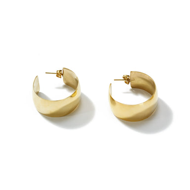 Striking and confident classic hoops handcrafted from upcycled brass to make a statement with bold, outspoken curves.