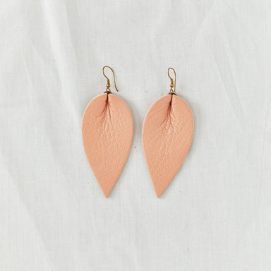 Classic design that transitions effortlessly from day to night, these blush leather leaf earrings are handcrafted from sustainable leather.