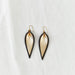 Classic design that transitions effortlessly from day to night, these black and gold leather leaf earrings are handcrafted from sustainable leather.