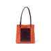 Just the right size for everyday, this red and purple tote is handcrafted from sustainable leather and features an exterior pocket.
