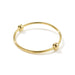A classic, but never boring, bangle handcrafted from upcycled brass and featuring two brass beads.