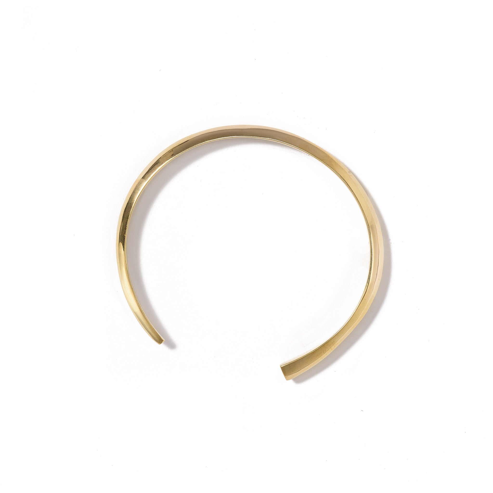 A classic cuff featuring a geometric and eclectic design, handcrafted from upcycled brass.