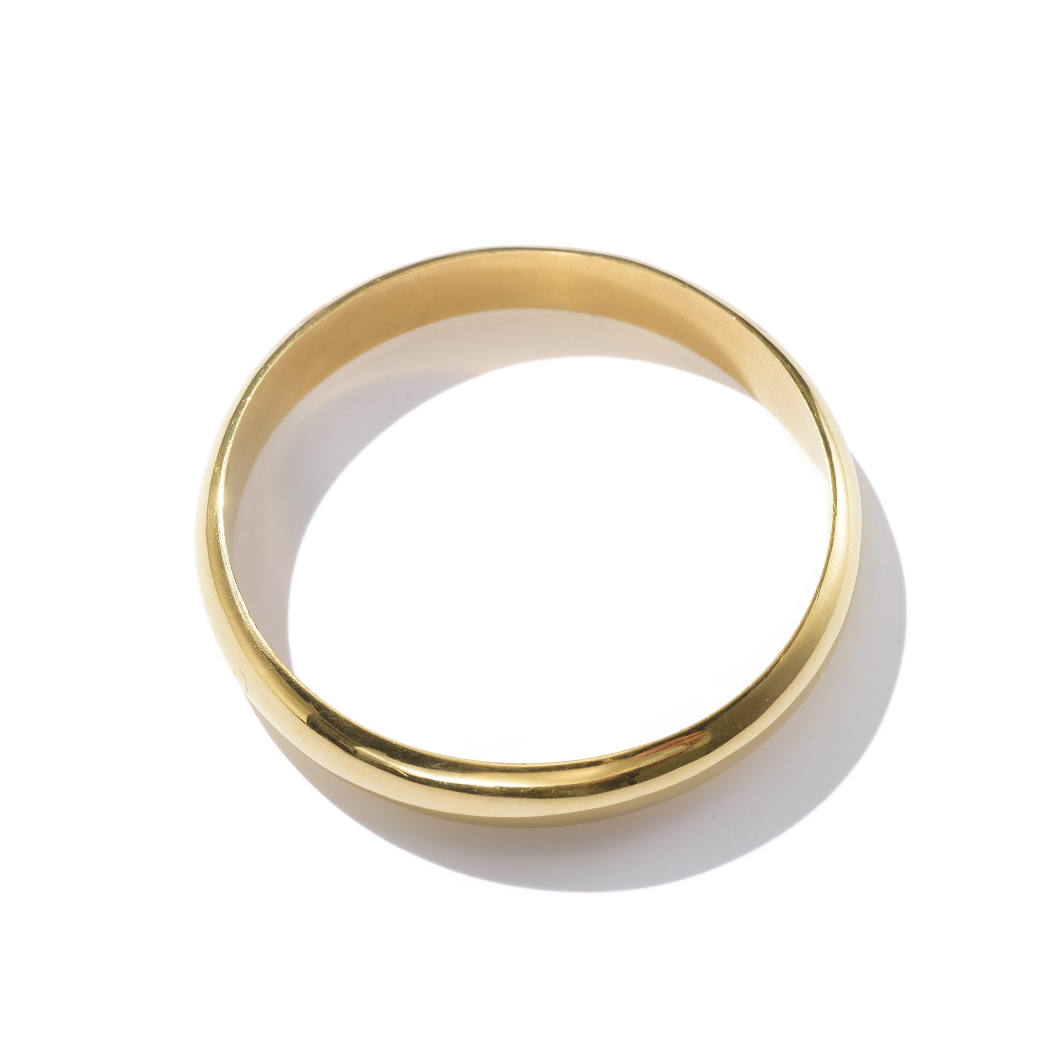 A boldly feminine and classic bangle handcrafted from upcycled brass in Kenya inspired by simple yet statement jewelry.