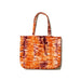 A carefree and charming orange tie-dye tote bag made from hand-spun 100% organic cotton and all natural dye.