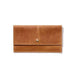 A brown wallet handcrafted from sustainable leather featuring a brass snap button closure and a minimalist design.