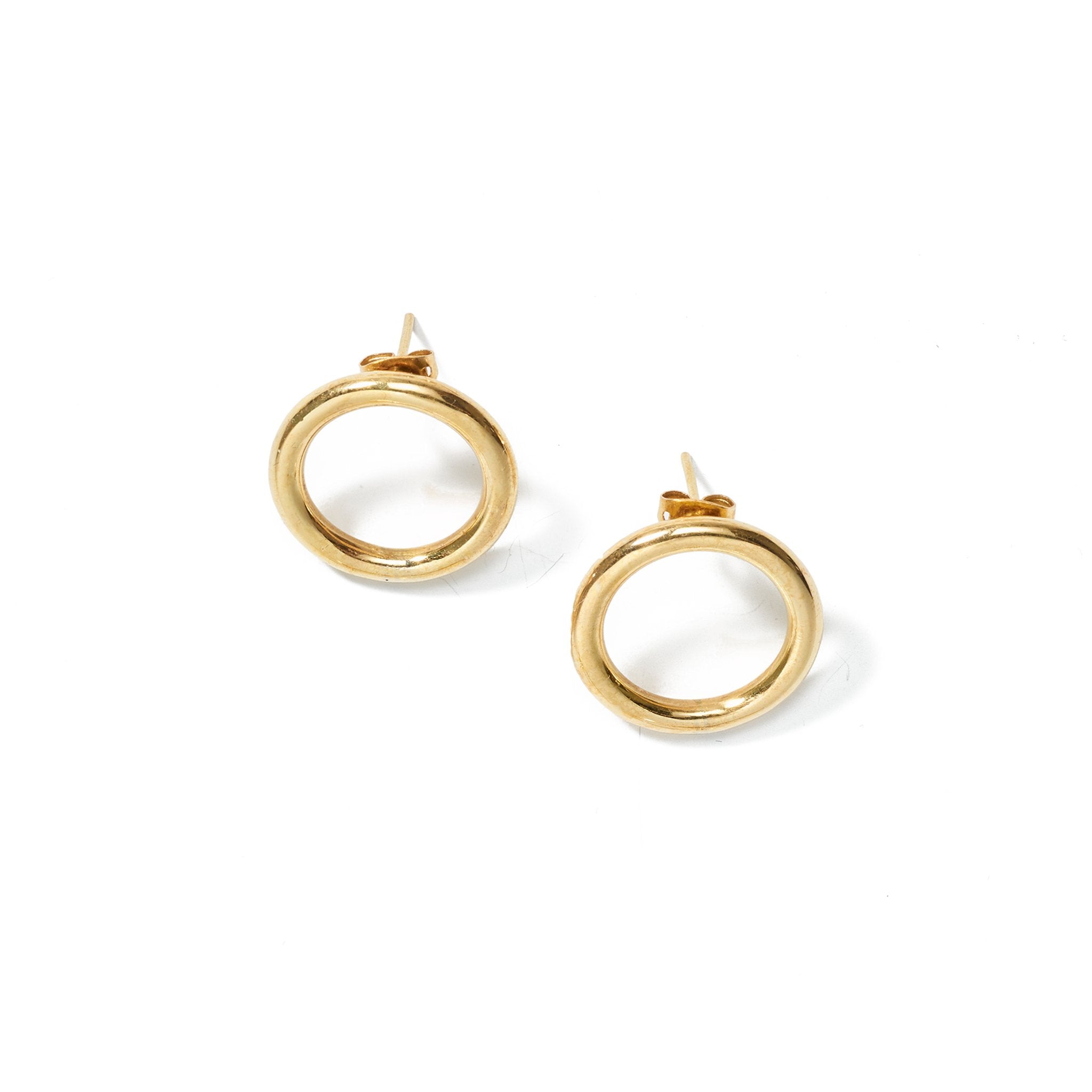 A delicate yet playful hoop earring that site parallel to ear, handcrafted from upcycled brass.