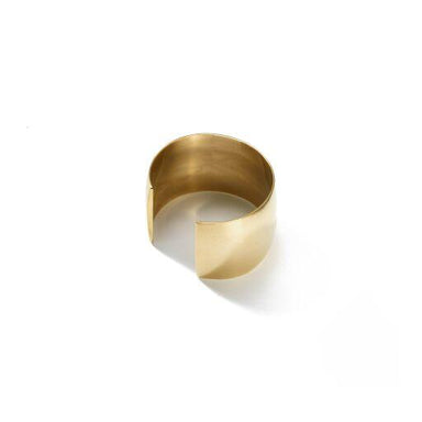 A bold and classic cuff handcrafted from upcycled brass and inspired simple statement jewelry.