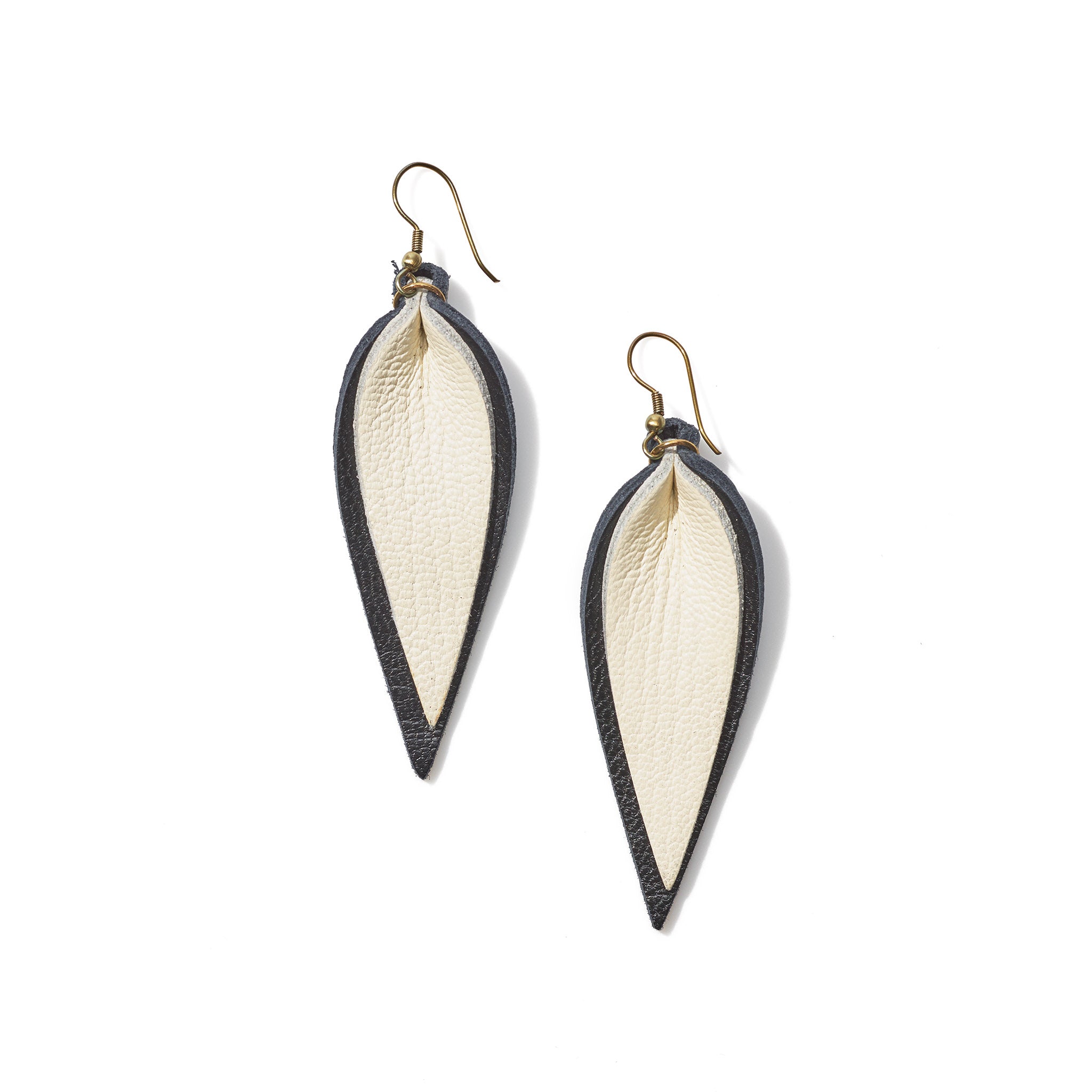 Classic design that transitions effortlessly from day to night, these black and white leather leaf earrings are handcrafted from sustainable leather.