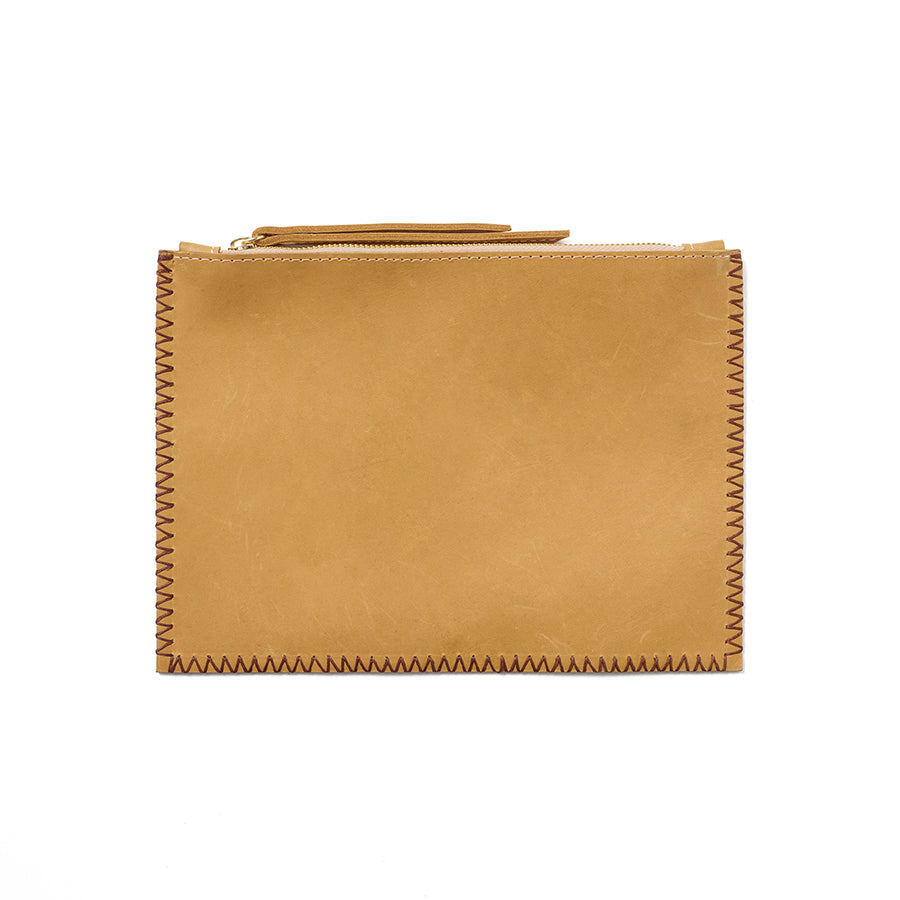 An yellow pouch with understated contrast stitching, handcrafted from sustainable leather.