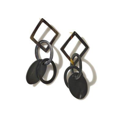 A striking pair of drop earrings handcrafted from upcycled horn and inspired by female artists Hilma af Klint and Emma Kunz.