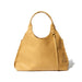 A yellow tote bag with a 1970's silhouette handcrafted from sustainable leather and lined with 100% Ethiopian cotton.