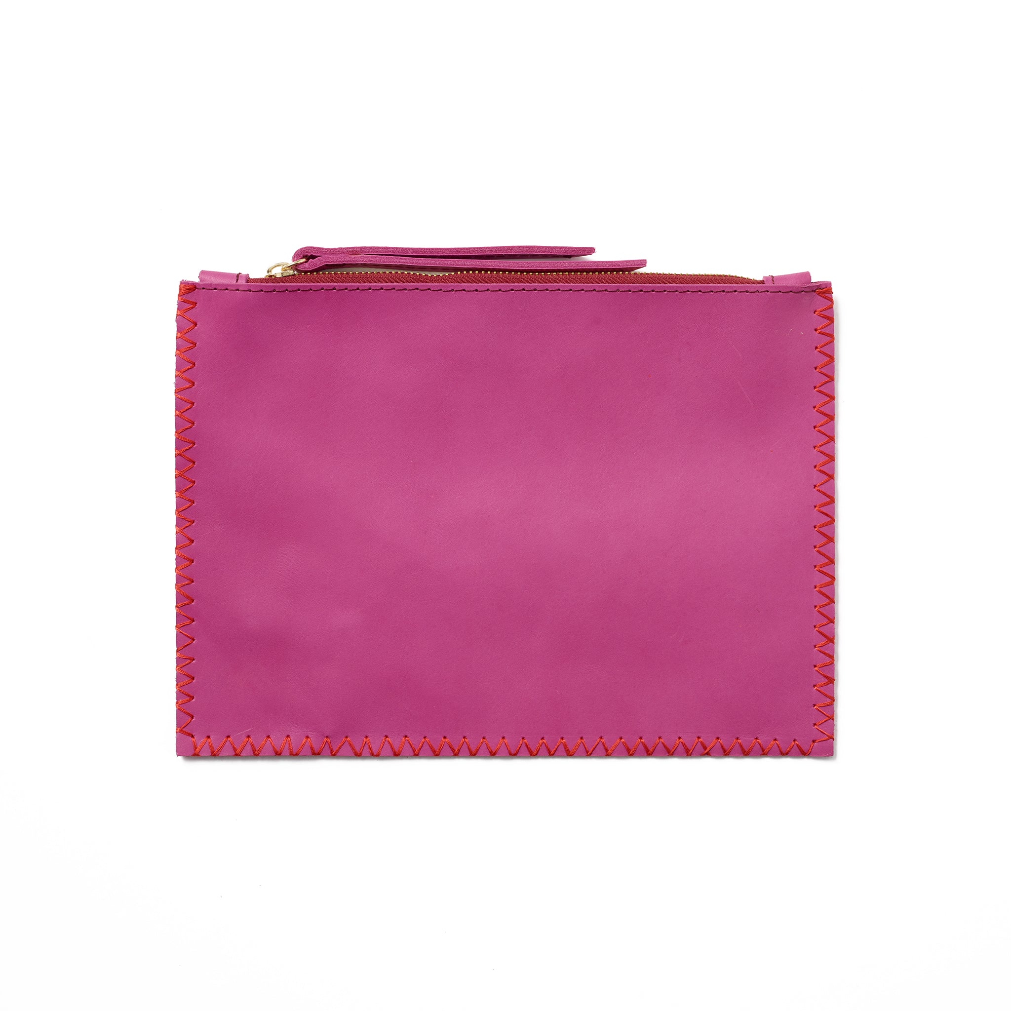 An pink pouch with understated contrast stitching, handcrafted from sustainable leather.
