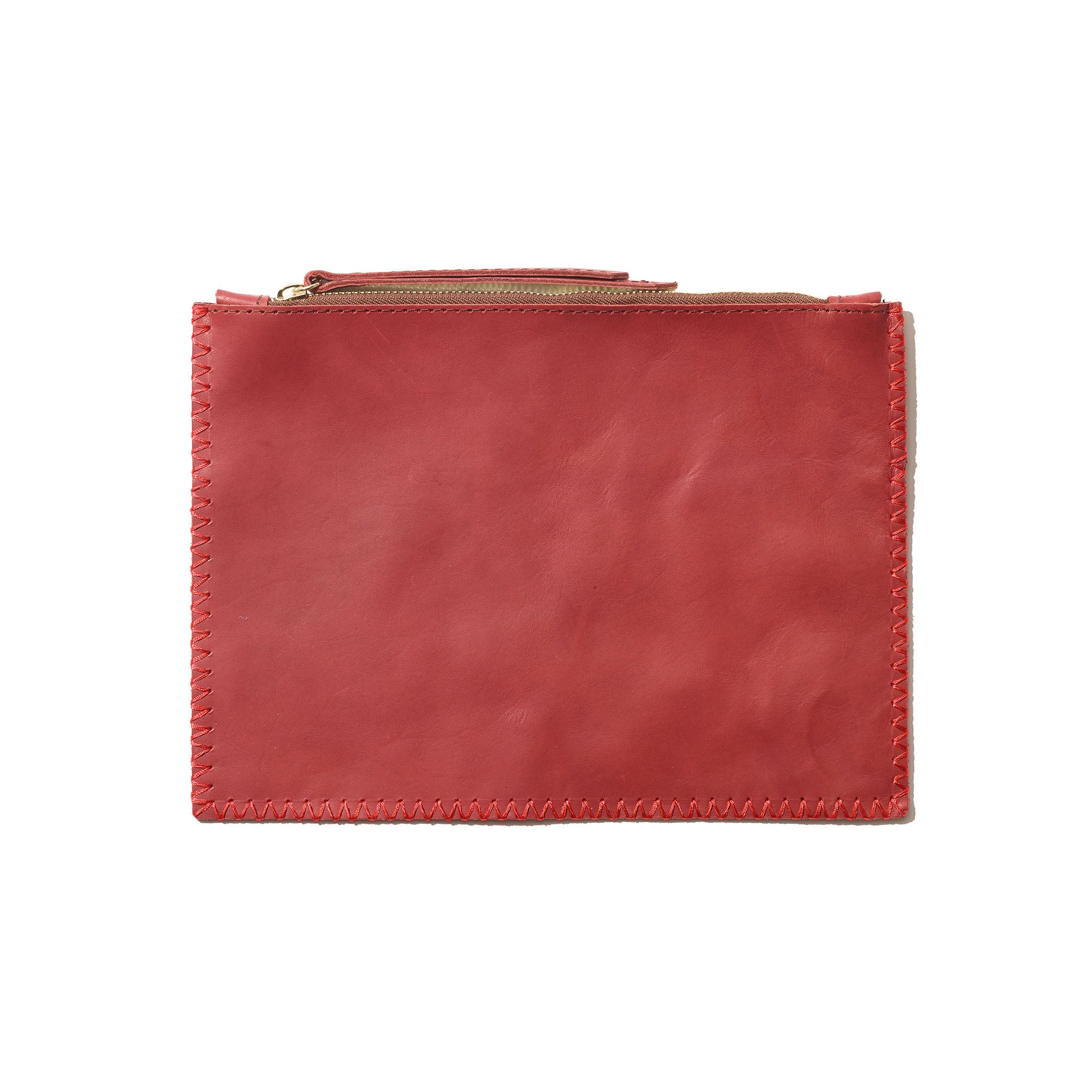 An red pouch with understated contrast stitching, handcrafted from sustainable leather.