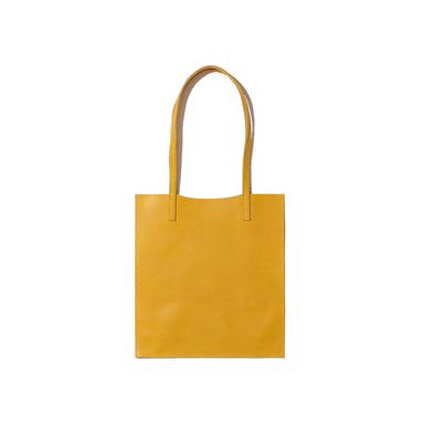 A yellow tote bag, understated yet sleek, handcrafted from sustainable leather.