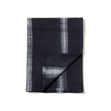 Update your table with this eye-catching black stripe tie-dye napkin, hand-spun and hand-woven from 100% Ethiopian cotton and dyed in small batches.
